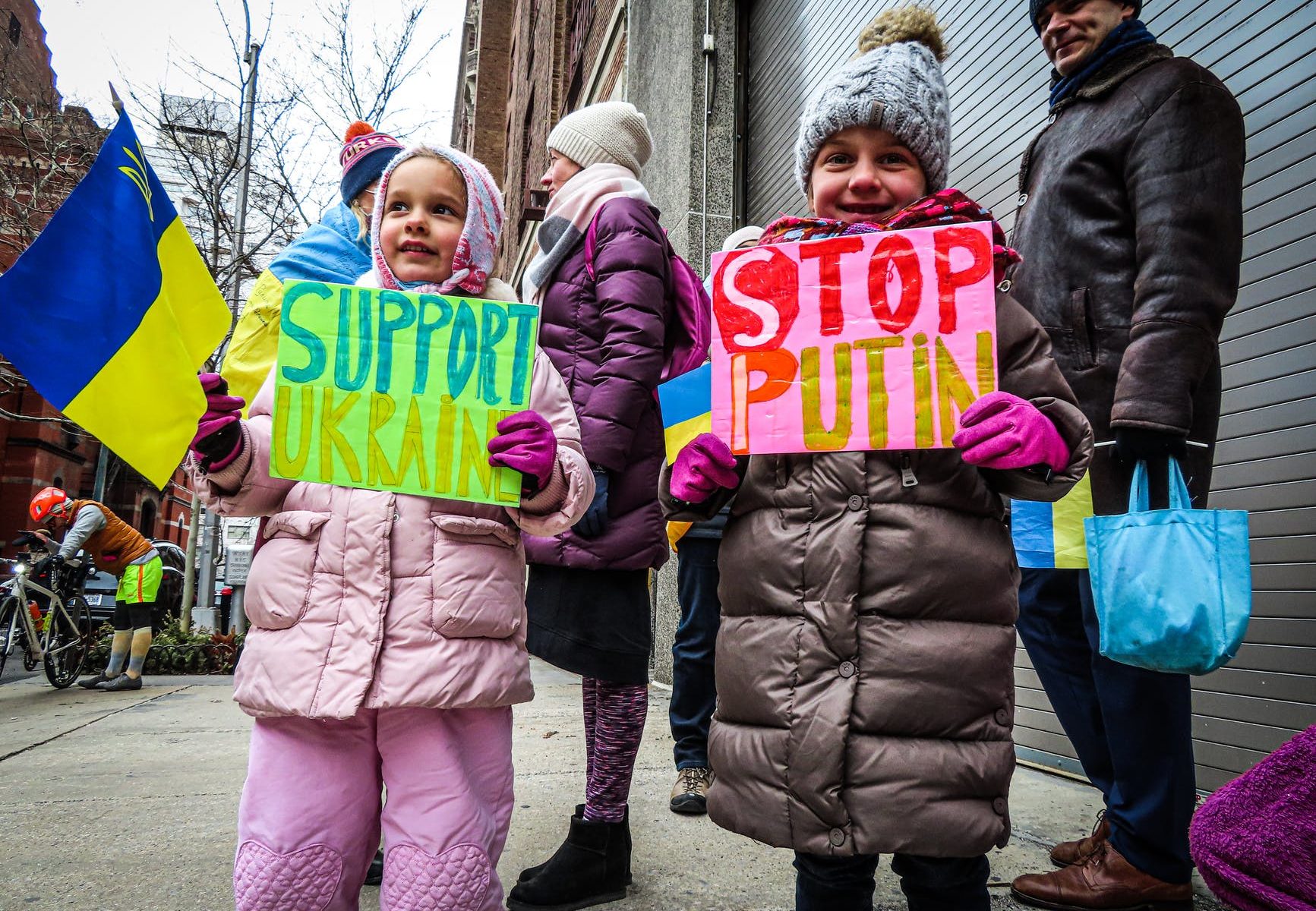 girls with signs on protest against russian war on ukraine